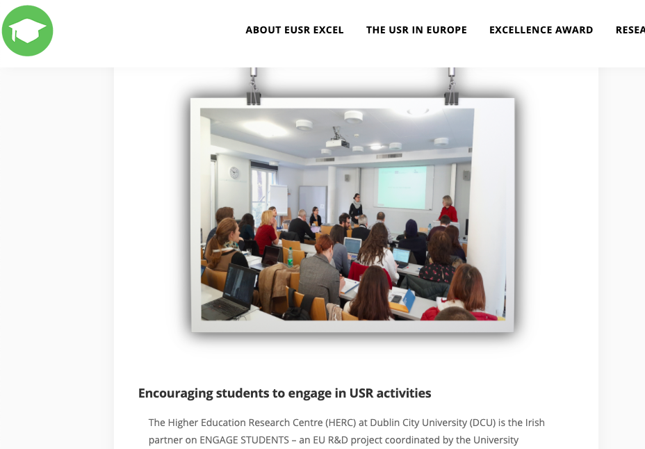 Photo of website showing a keynote speaker and audience in the University of Vienna
