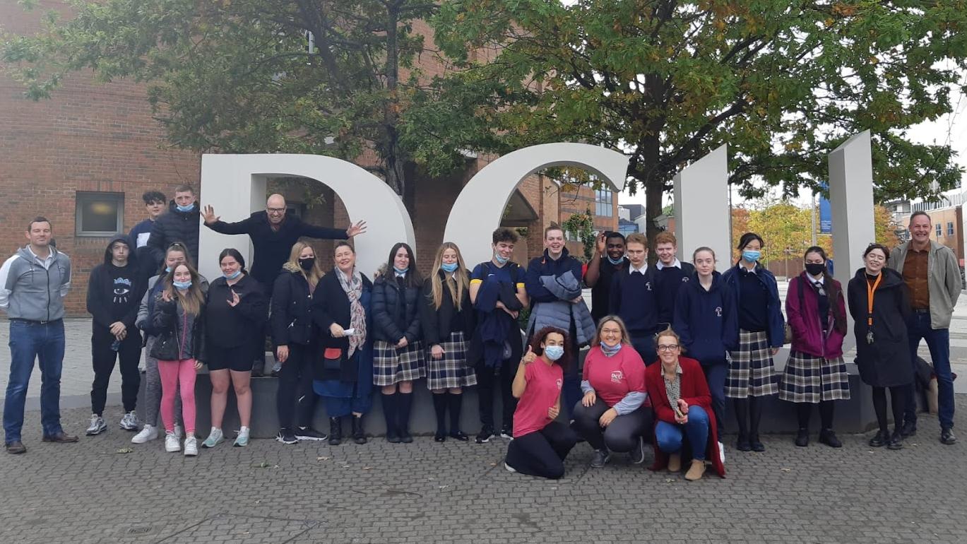 Change Makers group photo at DCU letters