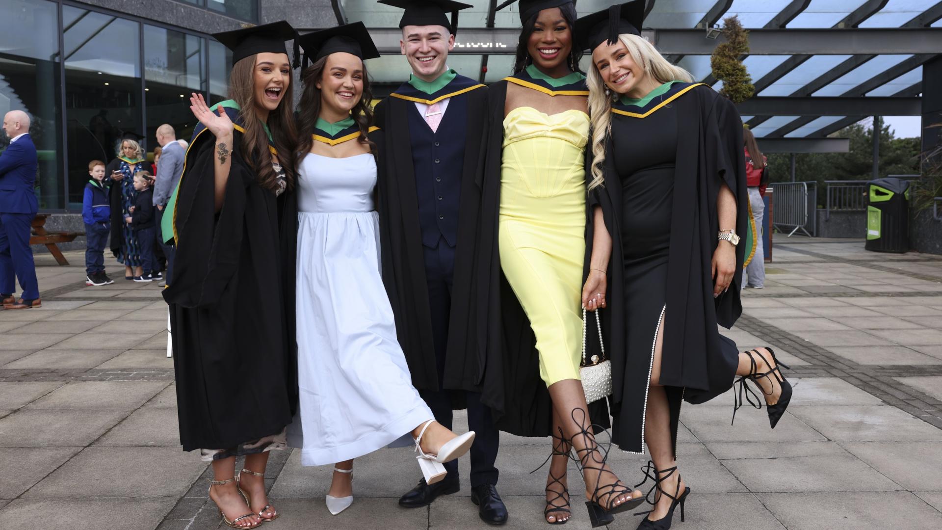 Shows group of DCU graduates outisde The Helix during the Spring Graduation in 2024