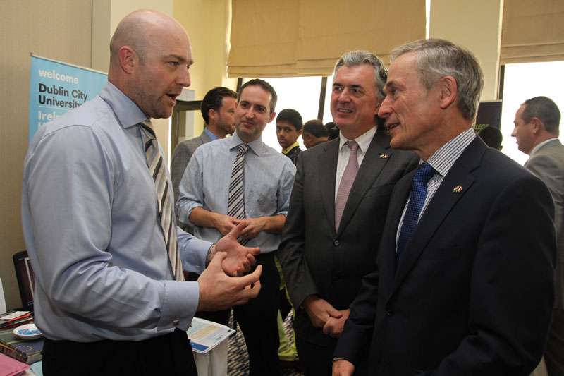 Minister Bruton visiting the DCU Stand at the Education Fair in Mumbai