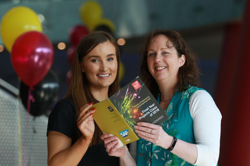 Prof. Lisa Looney and Jessica Hall from SAP read over the Expo Booklet