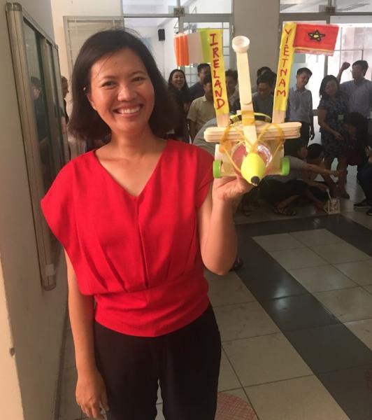 one of mu counterpart Nhi Phan holding a catapult winner of a student project bringing to bear physics and mathematics.Peace and Friendship was on the machine along with Ireland/Vietnam