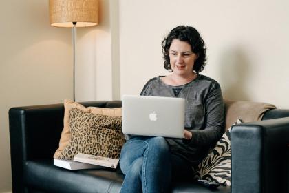 Student studying at home with a laptop
