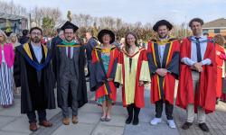 Michael Gaffney, Dr. Caitríona Ní Shé, and Dr. Aidan Fitzsimons at their graduation in March 2022 with their supervisors