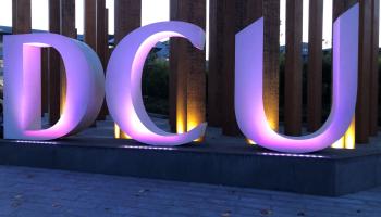 A DCU sign lit by purple lights. 70 buildings and landmarks across Ireland turned purple for Intersex Solidarity Day on 8 November 2020.