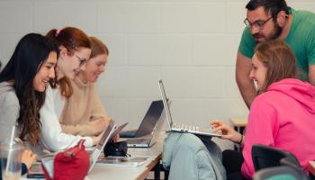 TY students doing maths with help from lecturer