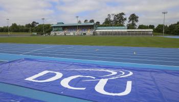 A wide shot of the newly upgraded track at Morton Stadium, with DCU logo.