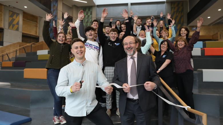 Niall Behan, Student's Union President and Prof. Brian MacCraith, President of Dublin City University surrounded by students and