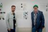 image of participants standing beside their artwork