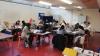 Headstart programme participants divided among tables in the Ballymun Adult Education service conducting groupwork