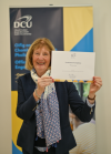 Participant at the PPN Summer School Graduation holding their certificate