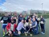 A group of students and councellors pose with balls and hurling sticks