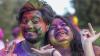 Student pictured with holi powdered colours on face