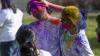 Student pictured with holi powdered colours on face