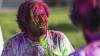 Student pictured with holi powdered colours on face