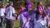 Student pictured with holi powdered colours on face