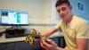 Student hold an autonomous vehicle