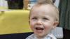 Shows a toddler at the DCU Bake Off for Barretstown
