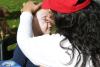 a woman face painting a child