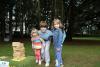 children posing in front of a pile of jenga blocks 