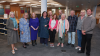 Eleven people facing the camera
