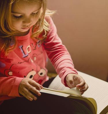 Child reading - Photo by Jonathan Borba on Unsplash