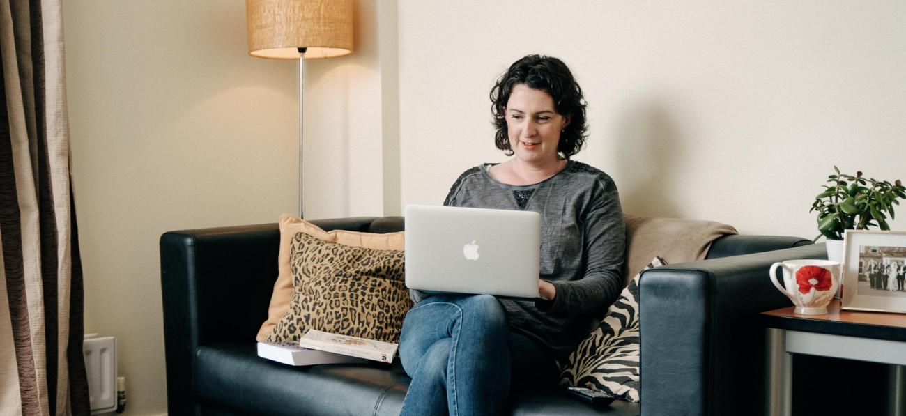 Student studying at home with a laptop