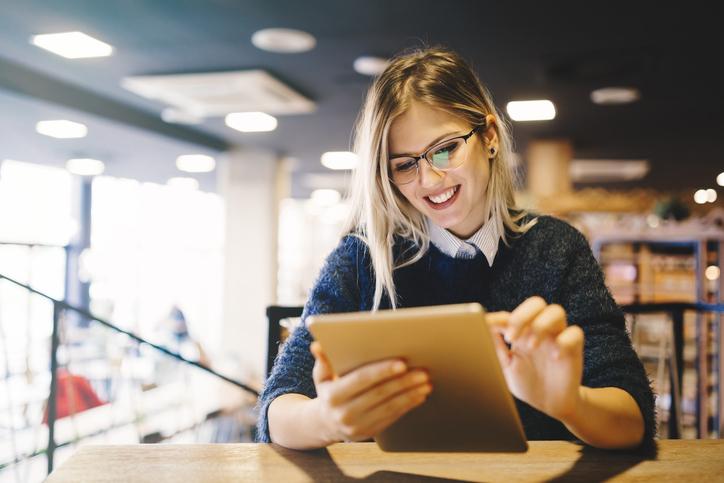 Postgraduate Single Module - student at desk with iPad