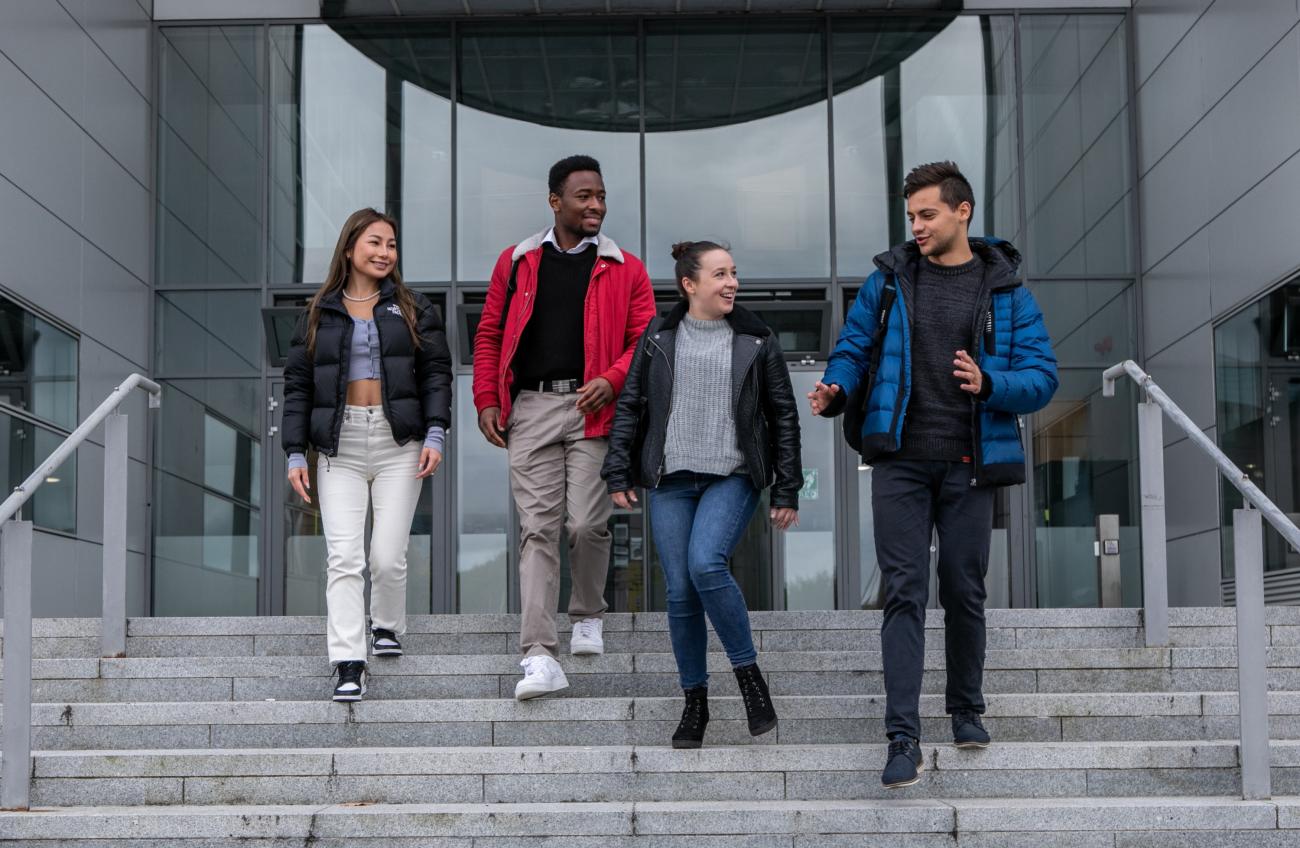 Students walking down steps