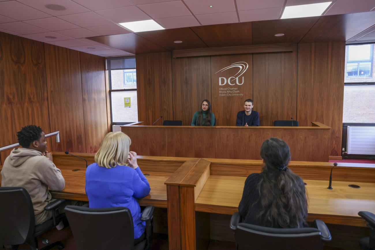 Students sitting in mock court room setting