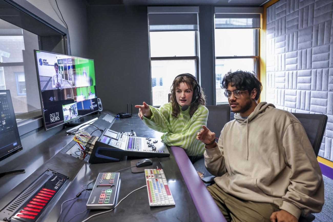 Students sitting at a mixing desk