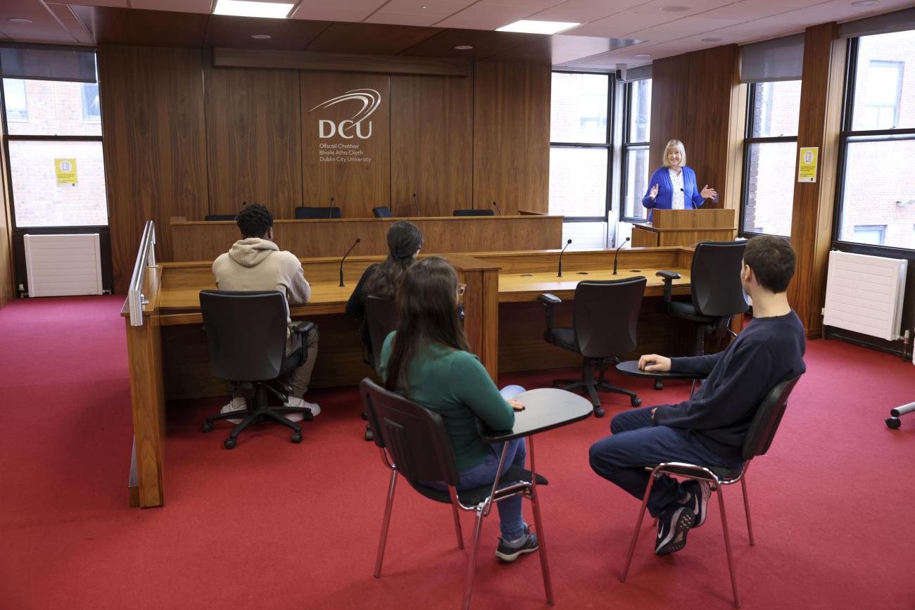 Students sitting in mock court room setting