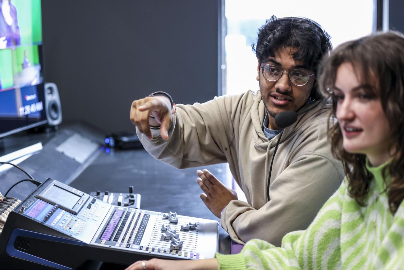 Students sitting at a mixing desk