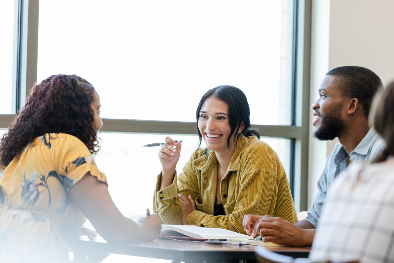 Students chatting around a table