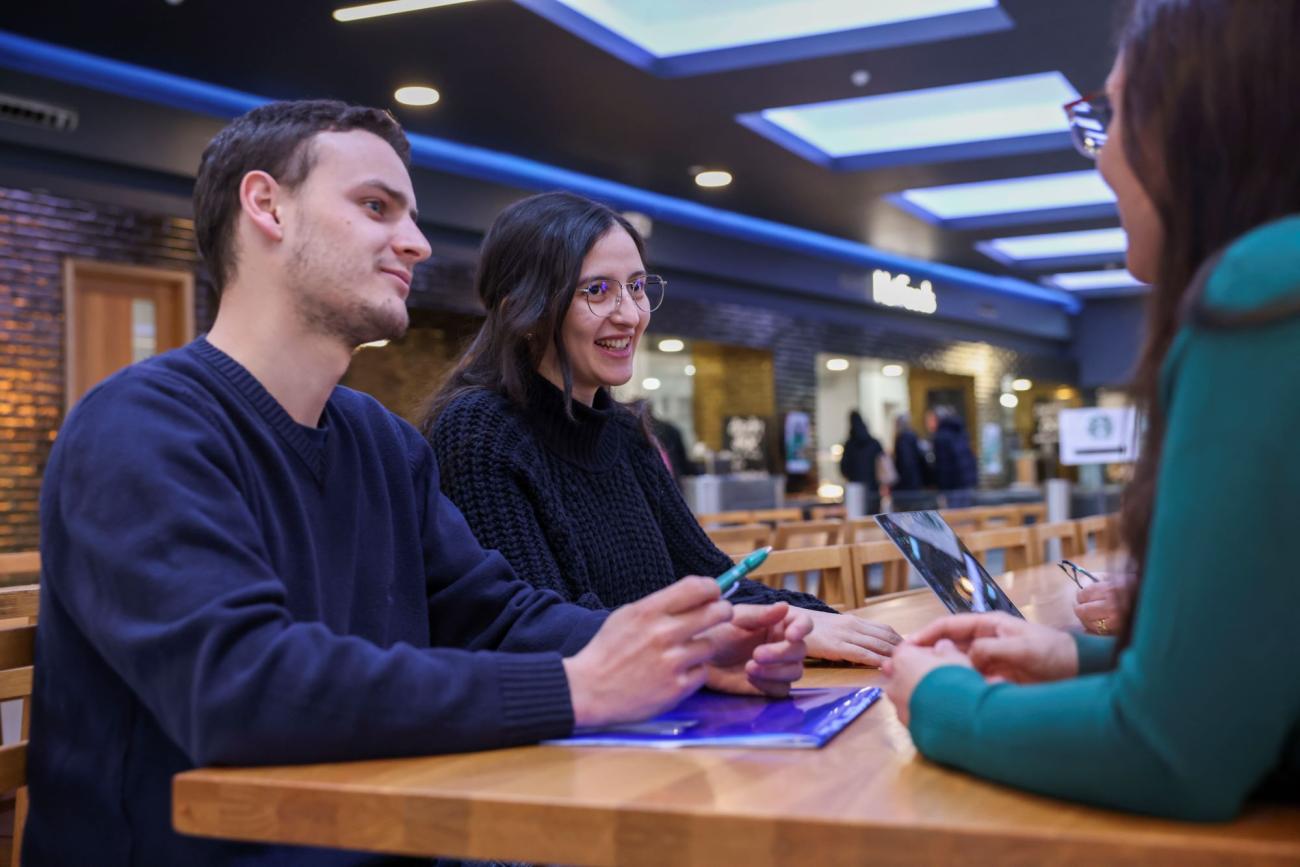 Students chatting around a table
