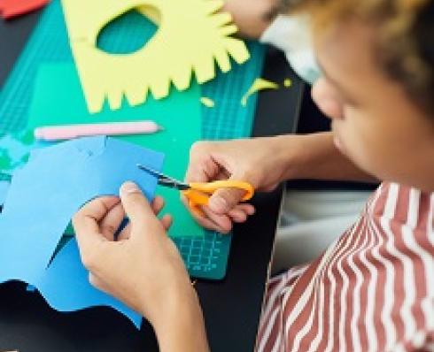 image of children cutting paper