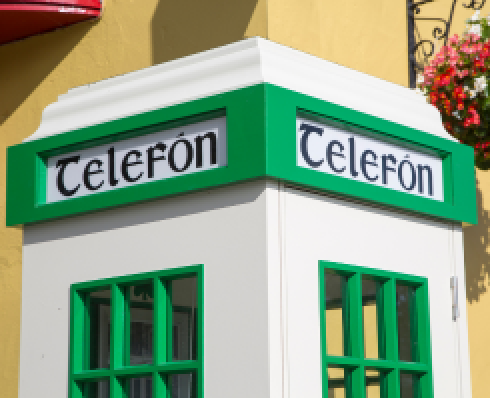 Shows the top of an Irish telephone box