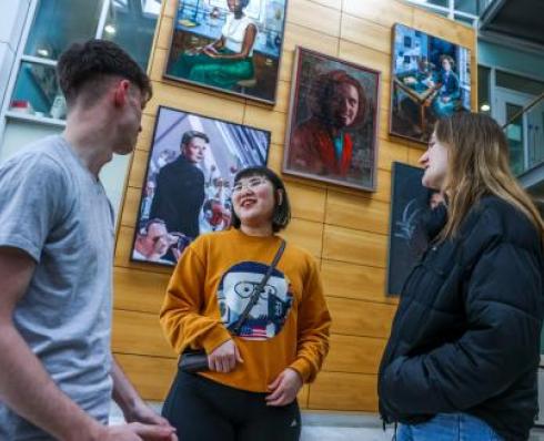 Image shows students talking in the Stokes Foyer