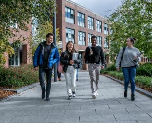 Students walk together around campus