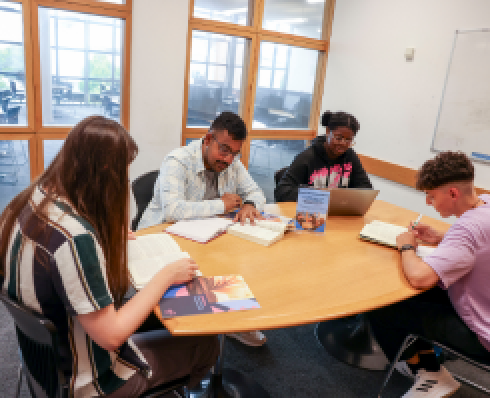 students studying in a group study room