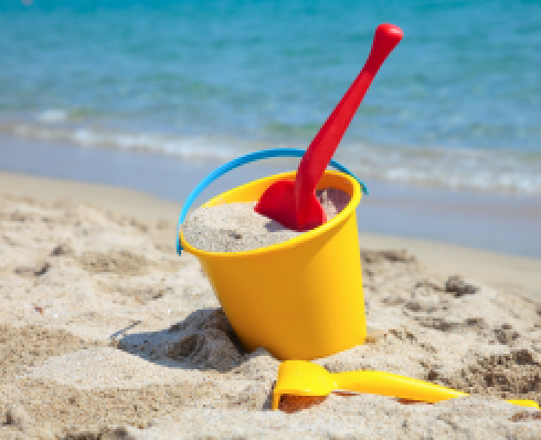 A bucket and space in the sand on the beach