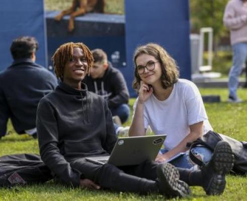 Students sitting in the sun on Glasnevin Campus