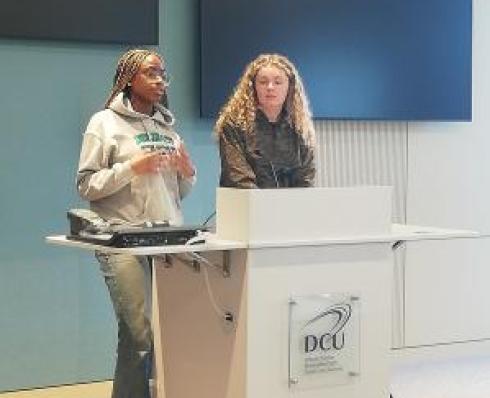 Students giving a talk on their student experience 