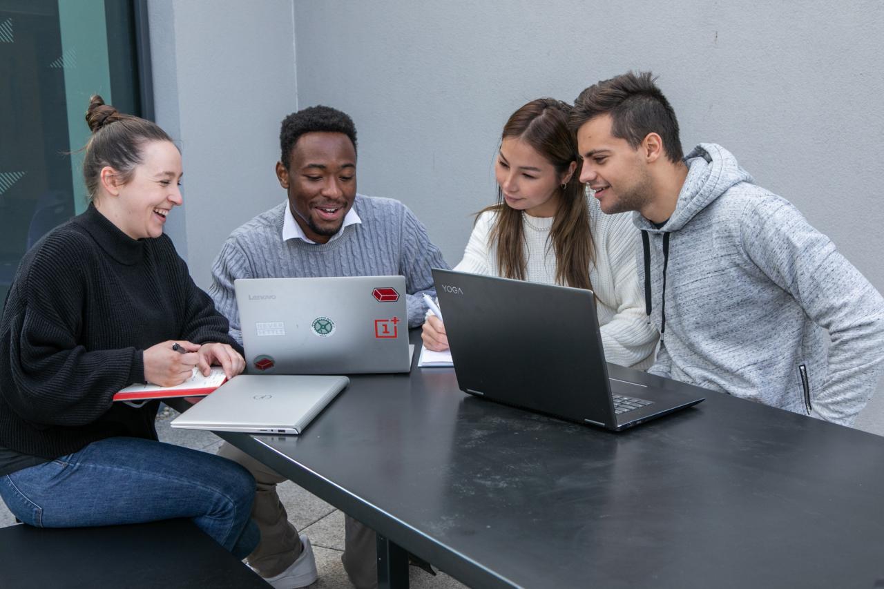 Students working on laptop