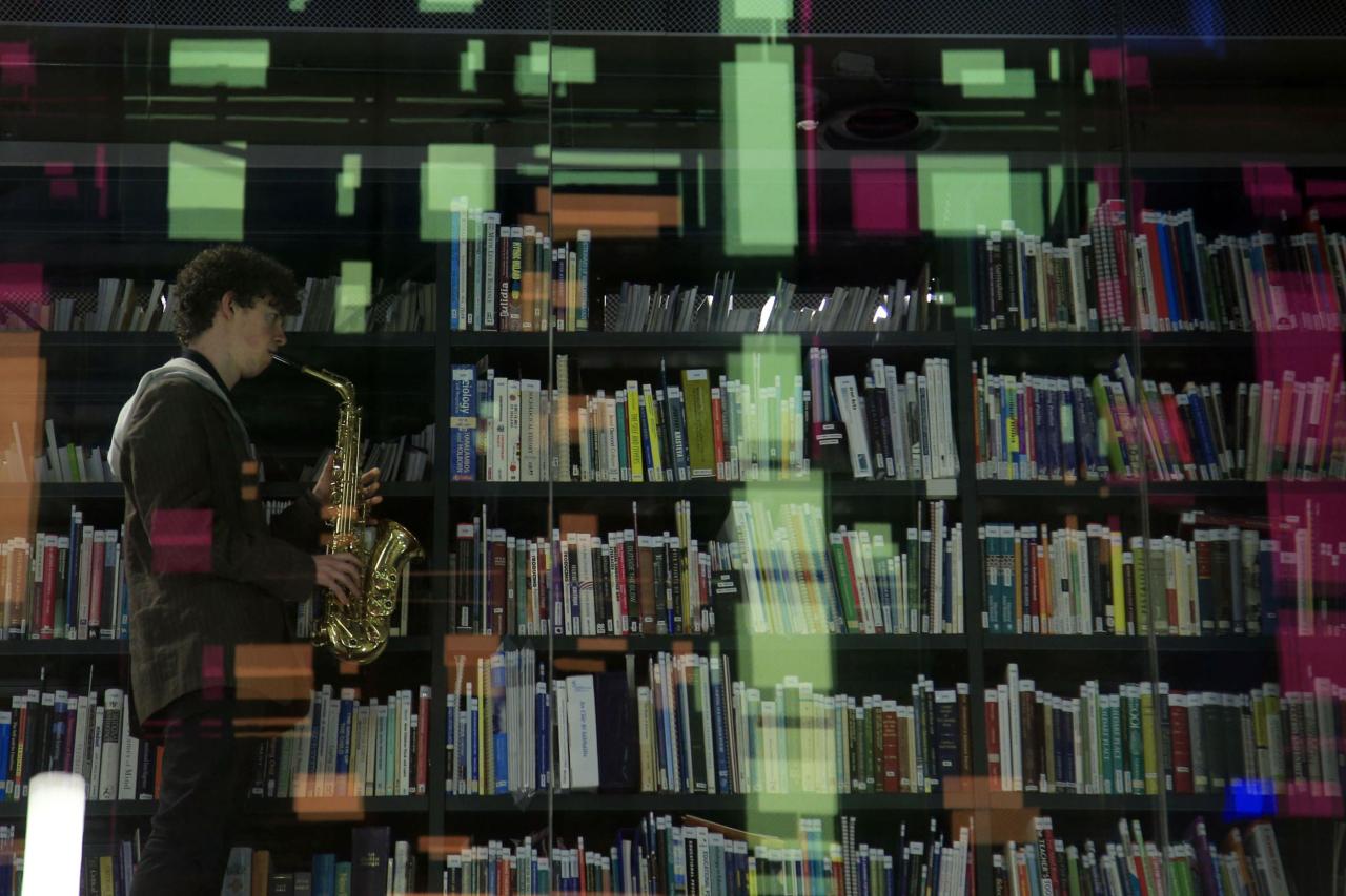 Man playing saxophone in Cregan Library