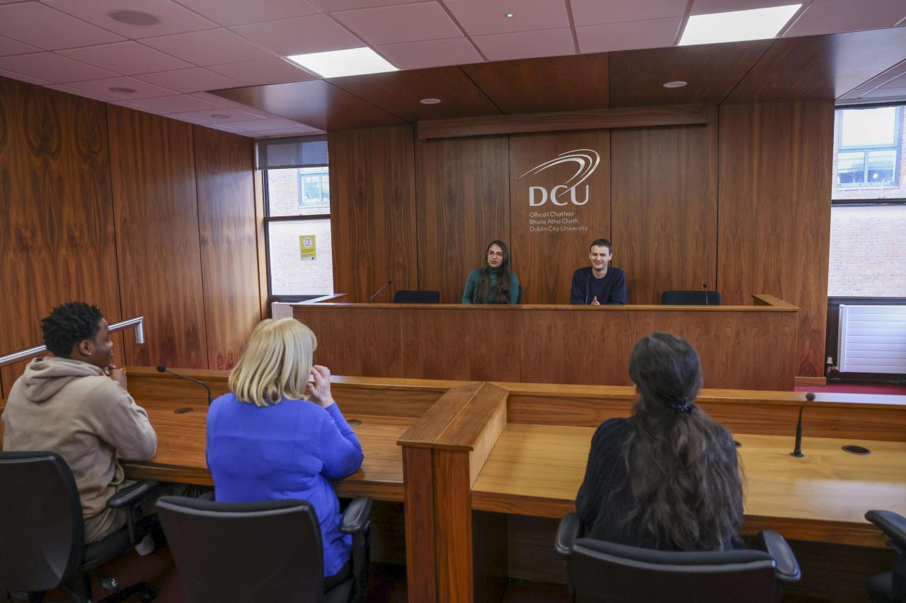 Students sitting in mock court room setting