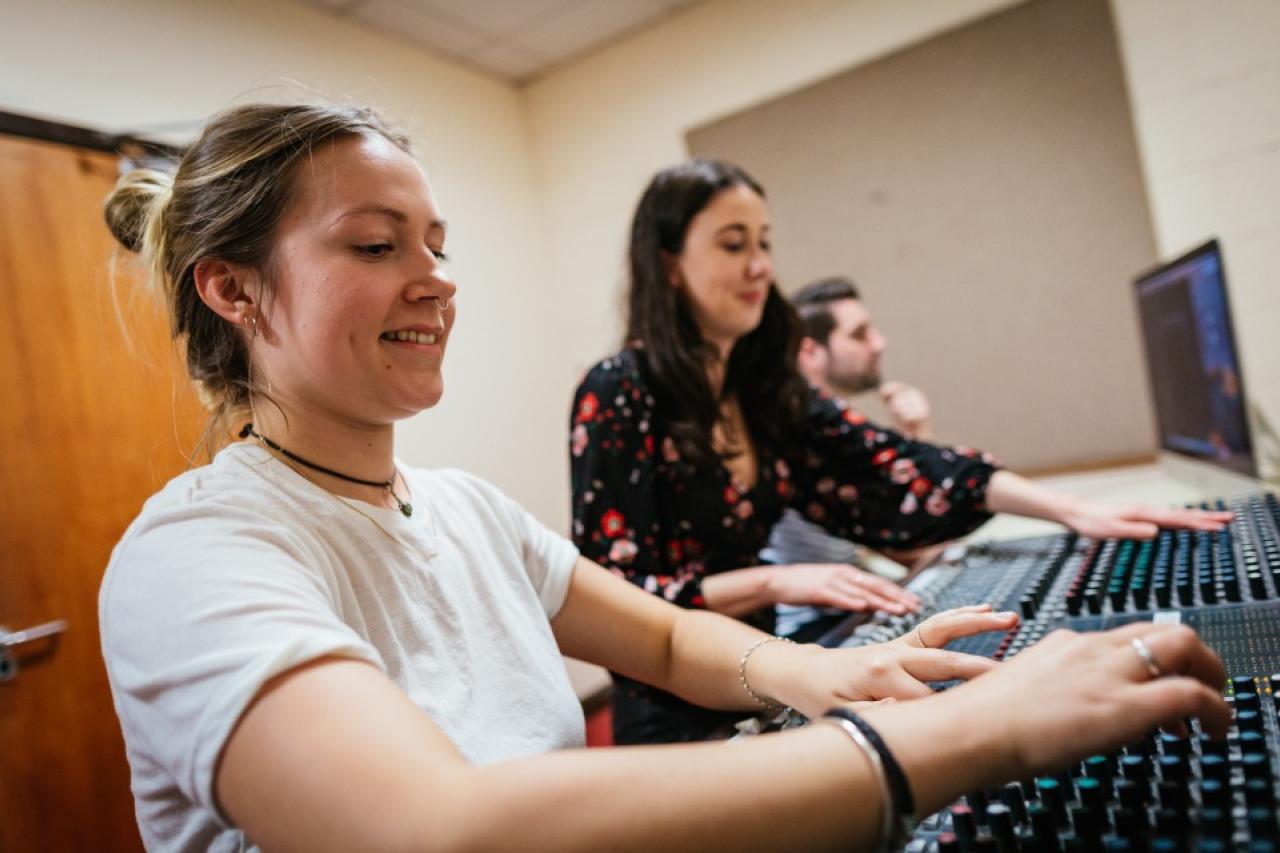 This image shows students working in the radio area