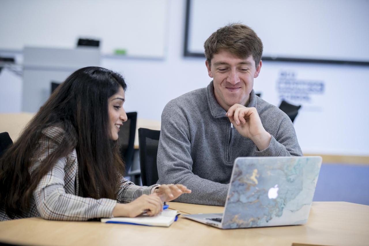 Shows two students chatting 