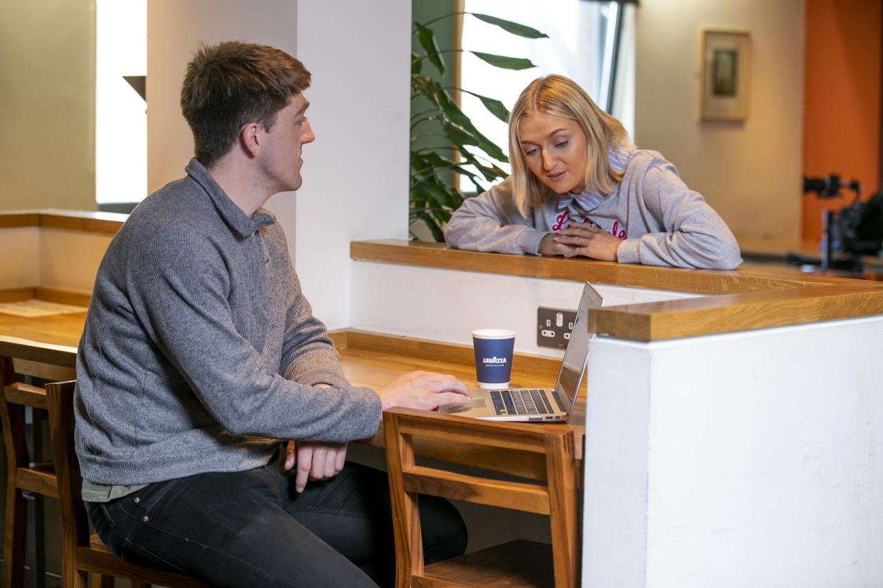 Shows two students chatting