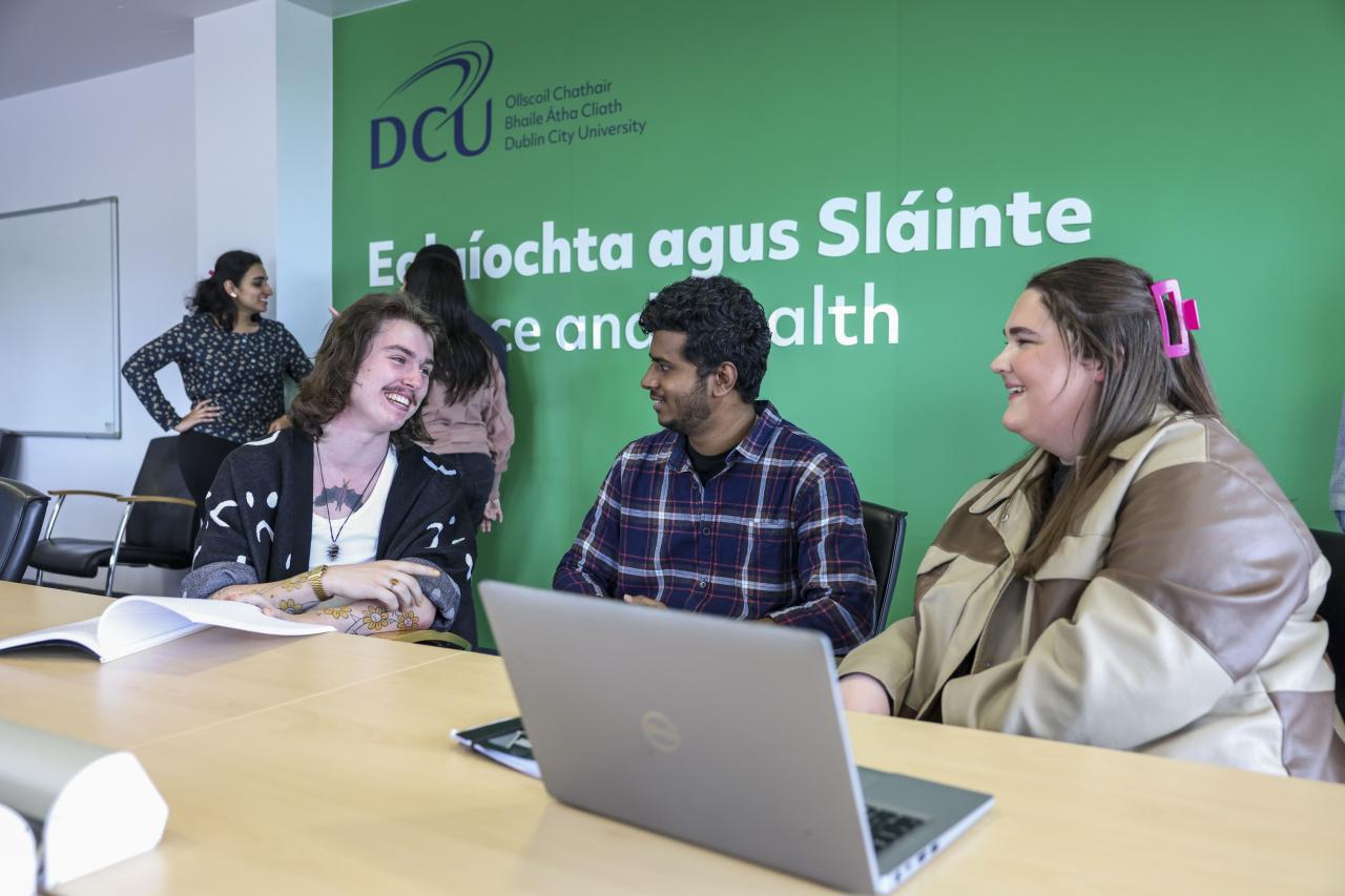 Shows group of students chatting in DCU Faculty of Science & Health